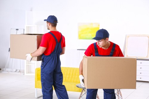 Moving team preparing items safely with protective equipment