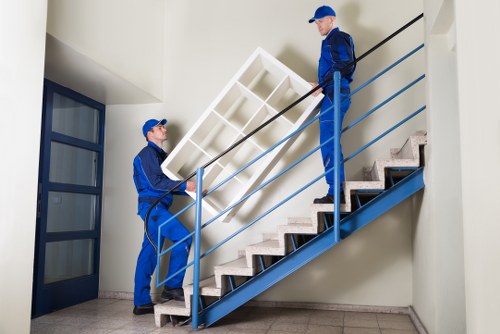 Removals team handling furniture during a house move