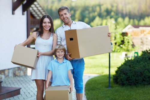Professional movers handling furniture in a Thornton Heath flat