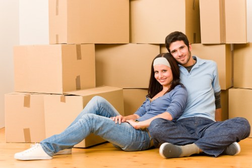 Packed office furniture and IT equipment prepared for relocation