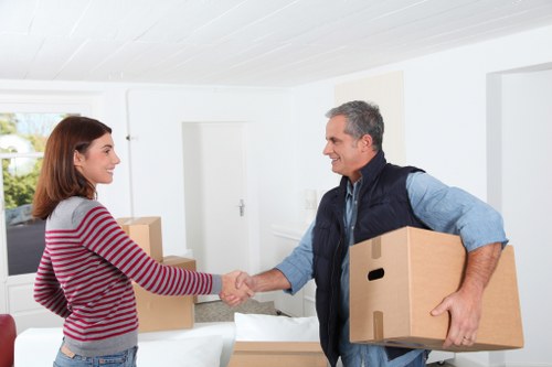 Professional removals team handling office furniture in South London