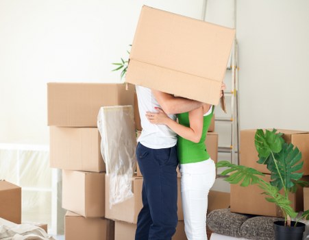 Movers carrying furniture through a typical Thornton Heath terraced property stairway