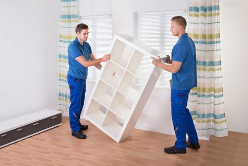 Furniture and boxes being loaded into a removal van